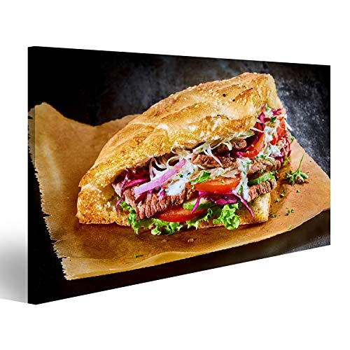Bild Bilder auf Leinwand Türkischer Döner-Kebab auf goldgeröstetem Pita-Brot gefüllt mit Rotisserie gebratenem Fleisch und frischen Salatzutaten auf braunem Papier serviert Wandbil von islandburner,