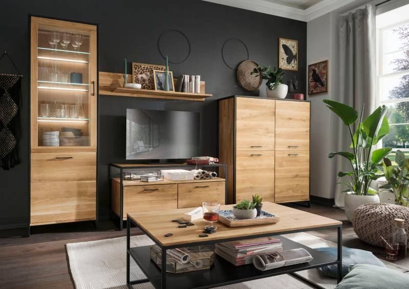 Massive Wohnwand Fiona aus Wildeiche mit schwarzem Metallrahmen von massive-naturmoebel