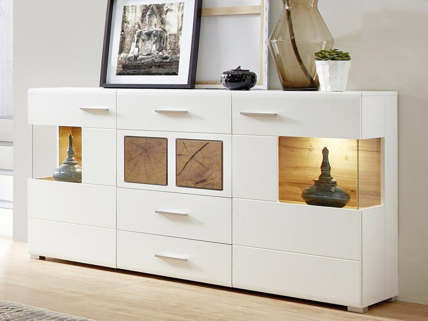 möbelando Sideboard Kathlin, Modernes Sideboard in Weiß-Matt, Korpus aus Spanpatte, Front aus MDF mit Absetzungen aus Spanplatte in Hirnholz Nachbildung mit 2 Glas-/Holztüren, 3 Schubkästen, 4 Konstruktionsböden und 1 Einlegeboden, inkl. LED-Beleuchtung. Breite 170 cm, Höhe 94 cm, Tiefe 42 cm von möbelando