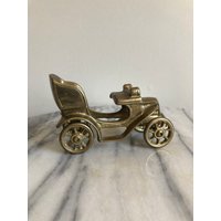 Vintage Messing Auto Mit Rädern, Die Rollen von rediscoverd