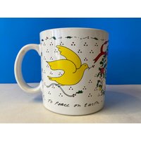 Taylor & Ng Peace On Earth Tasse von retrOKC