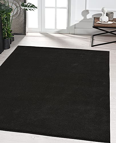 the carpet Marley eleganter Designer Teppich Wohnzimmer, weicher & pflegeleichter Kurzflor Wohnzimmerteppich in Schwarz, Teppich 60 x 110 cm von the carpet